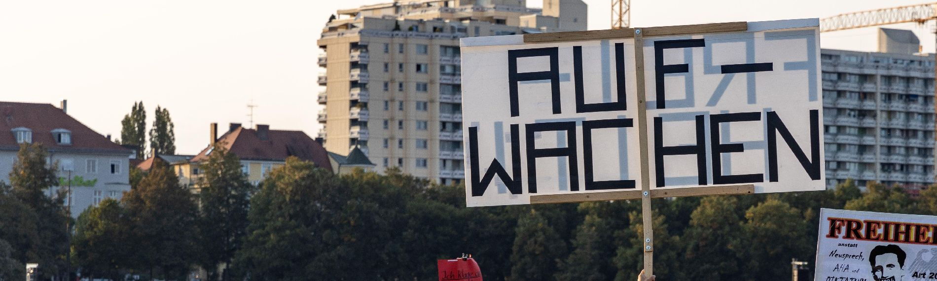 Photo of a demonstration poster with the inscription “Wake up”
